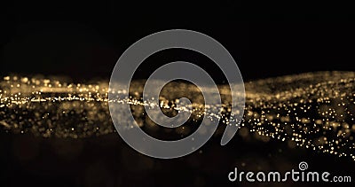 Golden glitter and sparkling light particles wave, glittering dust flow splash. Gold bokeh light glow, shimmering sparks flow Stock Photo