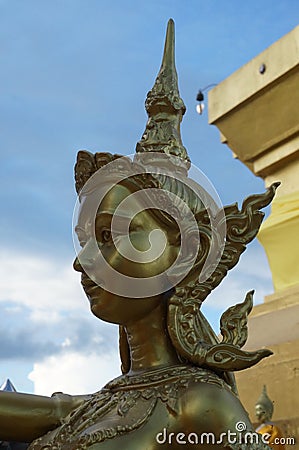 Golden goddess under the blue sky, daylight Stock Photo