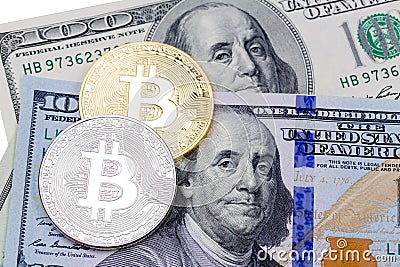 Golden and golden bitcoins on US dollars. Electronic money excha Stock Photo