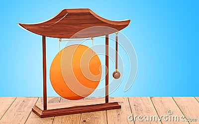 Golden gong on the wooden table. 3D rendering Stock Photo