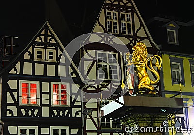 Golden Hachenburg Lion - symbol of town on Old Market square of Hachenburg, Rheinland-Pfalz, Germany at the night Stock Photo