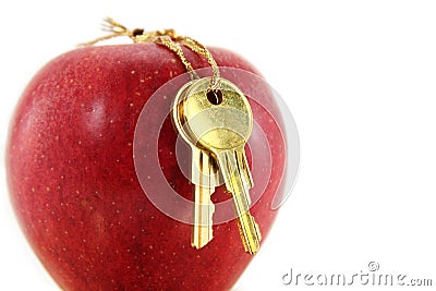 Golden key and red apple Stock Photo