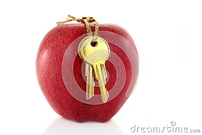 Golden key and red apple Stock Photo