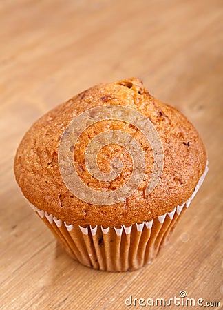 Golden Lemon Muffin on a Wooden Table Stock Photo