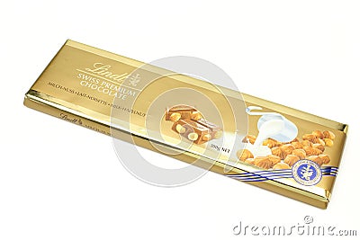 Golden Lindt with hazelnuts chocolate isolated on white background. Swiss premium brand Editorial Stock Photo