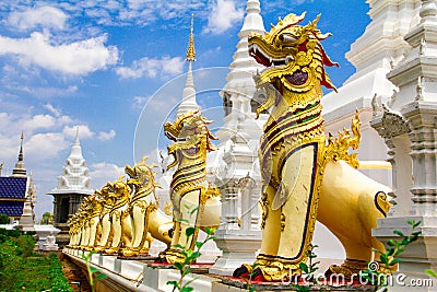 Golden lion guarding the pagoda Stock Photo