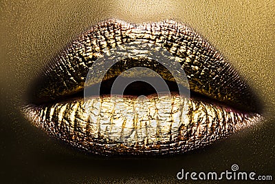 Golden lips makeup. Make up lip ideas. Colorful bright lipstick gold art concept. Stock Photo