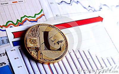 A golden litecoin on graph and diagrams Stock Photo