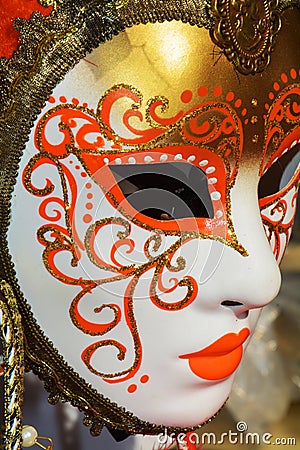 Golden mask with orange arabesques, Venice, Italy, Europe Stock Photo