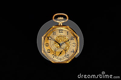 Golden mechanical antique pocket watch on black isolated background. Retro pocketwatch with second, minute and hour hand Stock Photo