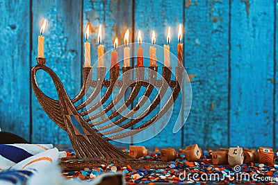 Golden menorah with flaming candles in the Chanukah Stock Photo