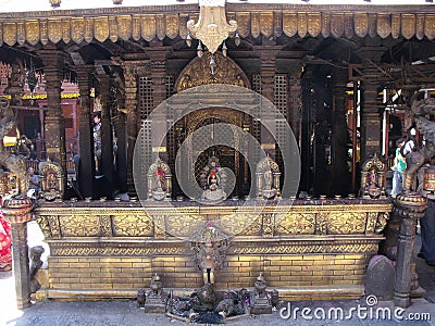 Golden metal altar inside Hiranya Varna Mahavihar. Golden Temple. Patan, Kathmandu. Nepal Stock Photo