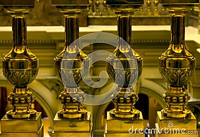 Golden metal balusters close up. Stock Photo