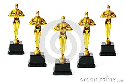 Hollywood Golden Oscar Academy award statue in medical mask. Success and victory concept. Oscar ceremony in coronavirus time Editorial Stock Photo