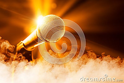 Golden microphone on stage Stock Photo