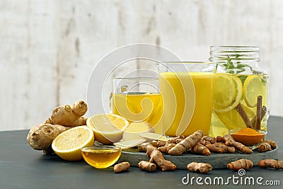 Golden milk detox water turmeric lemon and ginger Stock Photo