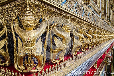 Golden Nagas. Gold ornamental patter statuettes. Ancient sculpture works. Wat Phra Kaew, Temple of the Emerald Buddha is famous te Stock Photo