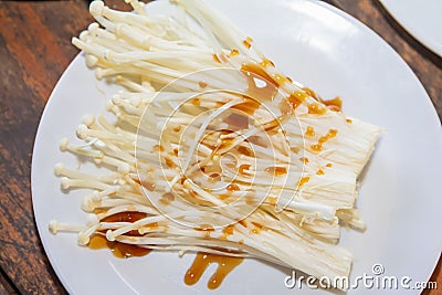 golden needle mushroom Ingredients and raw materials eating shabu, Sukiyaki, and pork on a white plate Stock Photo