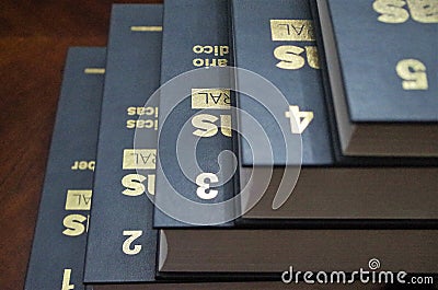 Golden numbers on a enciclopedia from one to five Stock Photo