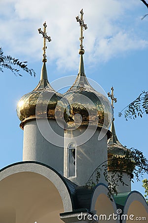 Golden onion domes on top of the belfry at the Presentation of the Child Jesus church in Tiraspol, Transnistria, Moldova Stock Photo