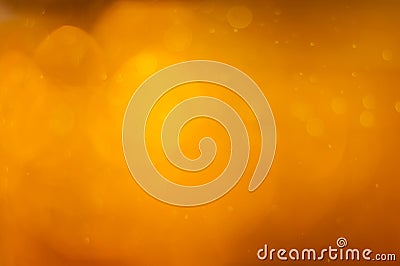 Golden orange bokeh or luxurious glitter lights festive background Stock Photo