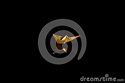 Golden origami boat on black background Stock Photo