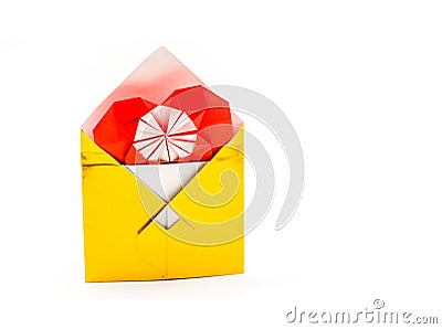 Golden origami envelope with red paper heart isolated on white Stock Photo
