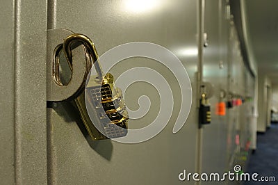 Golden padlock on a locker cupboard Stock Photo