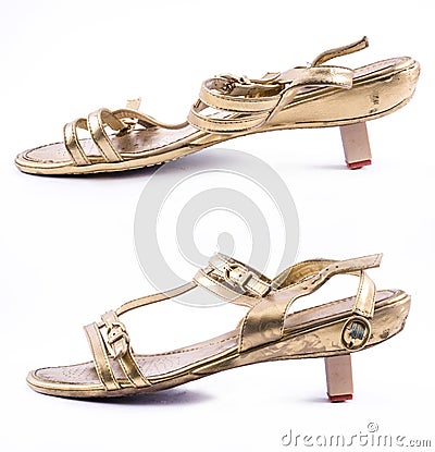 Golden painted, elegant, party shoes on a white background Stock Photo