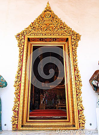 Golden painting stucco door frame, Thai ancient temple. Stock Photo