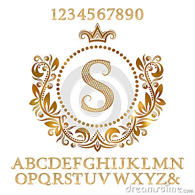 Golden patterned letters and numbers with initial monogram in coat of arms form. Shining font and elements kit for logo design Vector Illustration