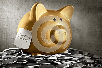 Golden piggybank with panama papers text Stock Photo