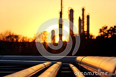 Golden pipe system against the sun in oil crude refinery Stock Photo