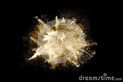 Golden powder explosion on black background Stock Photo