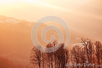 Golden rays of the sun at sunset in the mountains Stock Photo