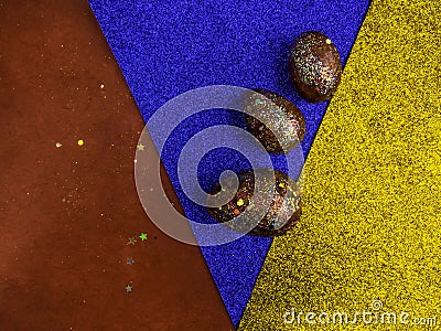 Golden red easter eggs, with acrylic painted, over multicolored festive background. Happy Easter celebration. Holiday element. Stock Photo