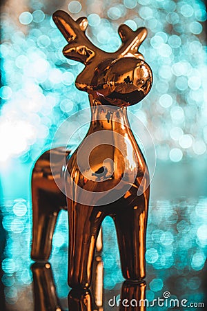 Golden reindeer Christmas decoration on top of a table Stock Photo
