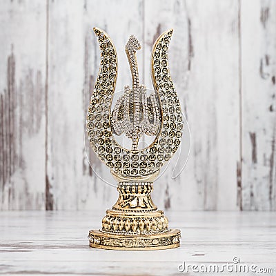 Golden Religious Statuette with the Names of Allah Stock Photo