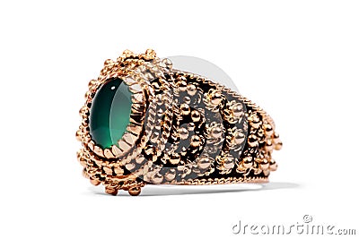 Golden ring with precious green gem Stock Photo