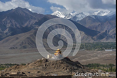 Golden roof monastery and snow mountain range Leh Ladakh ,India Stock Photo