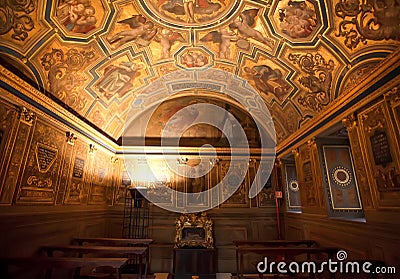 Golden room with bible theme painting on walls and ceiling inside 14th century Palazzo Vecchio, Florence. Italy Editorial Stock Photo