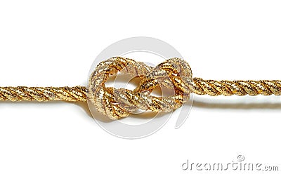 Golden rope with nautical knot isolated on white Stock Photo