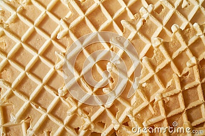 Golden round waffles background with irregular grid. Stock Photo