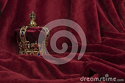 Royal crown on a red velvet background Stock Photo