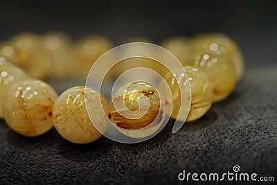 Golden Rutilated Quartz Bead bracelets lucky gemstone supplement good fortune Stock Photo