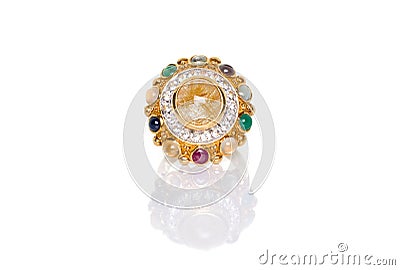 Golden Rutilated Quartz and diamonds with nine gemstones ring on white background with reflection. Collection of natural gemstones Stock Photo