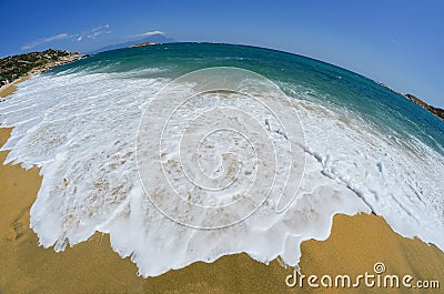 Golden sandy beach with white waves Stock Photo