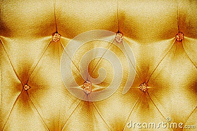 Golden satin cushioned textile Stock Photo