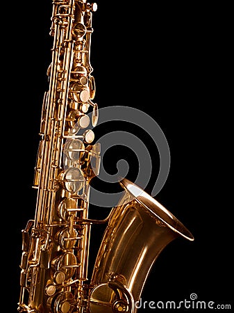 Golden saxophone on dark background. Stock Photo