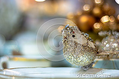 Golden shiny decorative christmas bird .Shallow depth of field Stock Photo